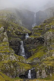 Mountainside Prints: Europe, Iceland. Thin waterfall cascades down a mountainside in southern Iceland