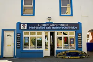 Watersport Prints: Europe, Ireland, Ballyvaughan. Store front of a dive center and watersports shop in the town center