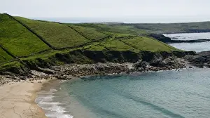 Donegal Prints: Europe, Ireland, Donegal. The blue sea meets the green hills on the coast. Credit as
