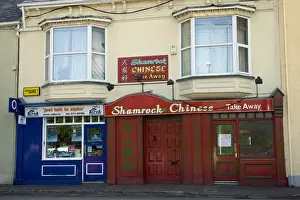 Residential Housing Prints: Europe, Ireland, Donegal. Shamrock Chinese Restaurant with red storefront. Credit as