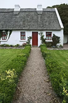 Europe, Ireland, Spiddal. Thatched-roof cottage. Credit as: Dennis Flaherty / Jaynes
