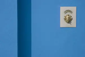 Lincoln Peak Prints: Europe, Italy, Burano. Blue wall and doorbell button within a brass lions head