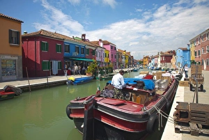 Images Dated 12th May 2010: Europe; Italy; Burano; Bright Colored Homes Along the Canal, Man Delivery Supplies