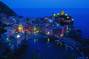 Europe, Italy, Cinque Terre, Vernazza. Hillside town from above in late evening