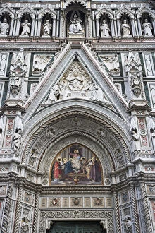 Images Dated 29th May 2006: Europe, Italy, Florence. Carvings and artwork near the front entrance of the Duomo