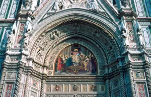 Europe, Italy, Florence. Painting and sculptures adorn the exterior facade of