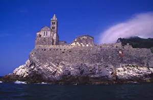 Europe, Italy, Gulf of Genoa. Church of St. Peter on cliff upon entering town of