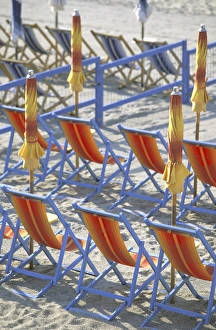 Images Dated 16th June 2011: Europe, Italy, Liguria, Riviera Di Ponente, Lugure, Beachfront, red beach chairs