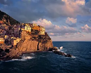 Cinque Terra Prints: Europe, Italy, Manarola. The cliff-nestled houses of Manarola look over the waves