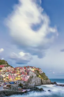 Images Dated 24th May 2013: Europe, Italy, Manarola. Cloud over coastal town
