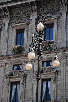Europe, Italy, Milan. Lanpost, windows and flower boxes in Milan