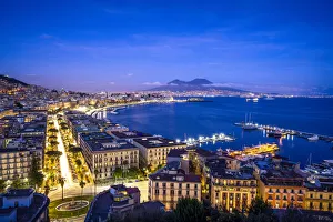 Campania Prints: Europe, Italy, Naples. Overview of city with Mt. Vesuvius at sunset