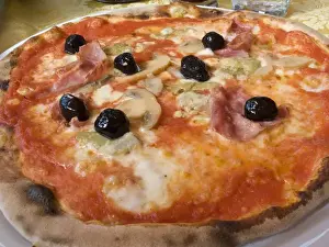Pleasure Prints: Europe, Italy, Positano. Plate of traditional Neapolitan pizza