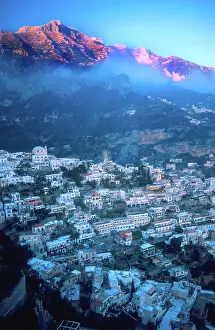 Amalfi Prints: Europe, Italy, Positano. Sun hits the mountain peaks along the Amalfi Coast