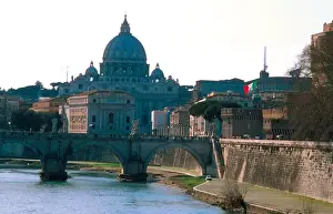 Tiber River Prints: Europe, Italy, Rome. St. Peters Basilica looms over the Tiber River