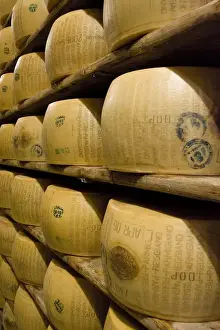 Cheese Prints: Europe, Italy, Ruberia. Shelves of aging Parmigiano-Reggiano cheese. Credit as: Wendy