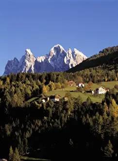 Jagged Prints: Europe, Italy, San Pietro. The crags of the Odle Group tower over the hillside village
