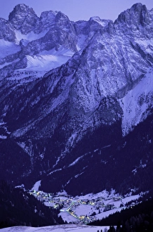 Europe, Italy, Trentino, Alto Adige, Passo di Sella. Winter evening view of Canazei