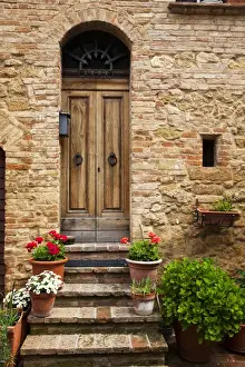 Images Dated 17th May 2010: Europe; Italy; Tuscany; Pienza; Doorway withFlowers Around them