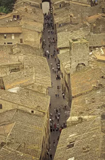 Europe, Italy, Tuscany, San Gimignano View of Via San Giovanni from Palazzo del Popolo