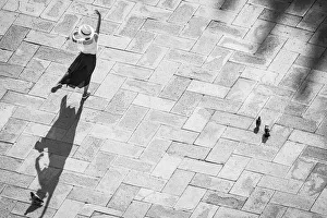Jim Nilsen Prints: Europe, Italy, Venice. Black and white of tourist poising for photo on San Marco Square