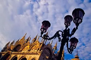 Europe, Italy, Venice. Byzantine Basilica and lamppost in San Marco Square