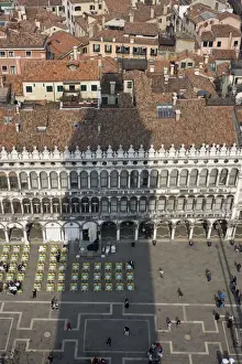 Europe, Italy, Venice. Campanile casts shadow over tile rooftops around Piazza San Marco