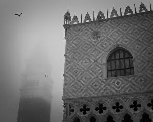 Europe, Italy, Venice. The Doges Palace and Campanile in the mist. Credit as