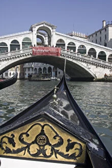 Europe, Italy, Venice. Prow of gondola approaching Rialto Bridge. Credit as: Bill