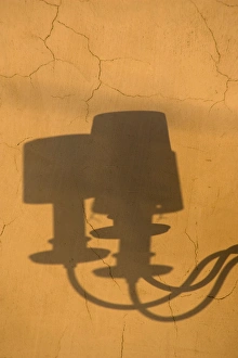 Images Dated 12th February 2009: Europe, Italy, Venice. Shadows of a lamp on a yellow wall