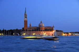 Riviera Prints: Europe, Italy, Venice. Water taxis blured at night. UNESCO World Heritage Site