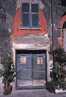 Cinque Terra Prints: Europe, Italy, Vernazza. Blue wooden doors are accented by the red walls and ancient