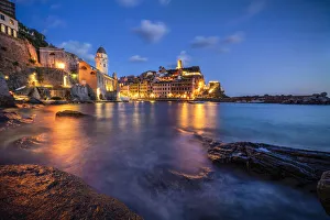 Lighting Prints: Europe, Italy, Vernazza. Landscape with village and ocean at sunset