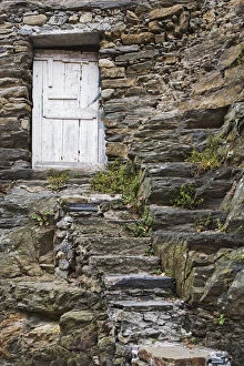 Images Dated 28th May 2006: Europe, Italy, Vernazza. Rock steps lead to an old wooden door
