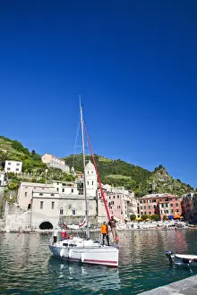 Images Dated 24th May 2010: Europe; Italy; Vernazza; Sail Boat landing at the City and Church of Santa Margherita