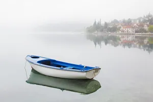Still Prints: Europe, Montenegro, Kotar. Small boat on calm water