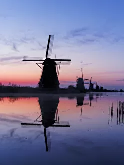Netherlands, Holland Gallery: Europe; Netherlands; Kinderdijk; Windmills at Sunrise along the canals of Kinderdijk