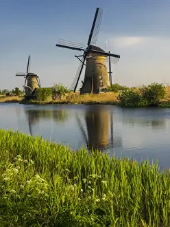 Zuid Prints: Europe; Netherleands; Kinderdyk; Windmills with evening light along the canals of Kinderdijk