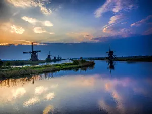 Images Dated 20th April 2014: Europe; Netherleands; Kinderdyk; Windmills at Sunrise along the canals of Kinderdijk