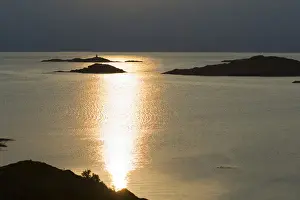 Reflecting Prints: Europe, Norway, Vesteralen. Midnight sun reflecting in the Atlantic Ocean