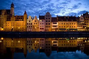 Images Dated 20th June 2009: Europe, Poland, Gdansk. Buildings reflect in port water at sunset