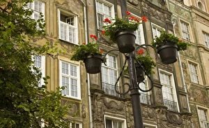 Europe, Poland, Gdansk. Flower pots decorate front of buildings in Old Town. Credit as