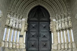 Europe, Portugal, Evora. Carved figures of the Apostles adorn the gothic entrance