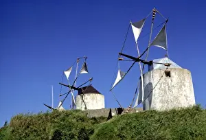 Europe, Portugal, Leiria. Windmills dot the countryside in the Leiria District, Portugal