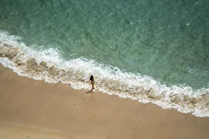 Jim Nilsen Prints: Europe, Portugal, Nazare. Girl in surf on beach