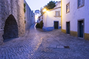 Images Dated 24th June 2015: Europe, Portugal, Obidos. Leira District. Cobblestone walkways, at sunset