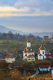 Romania Collection: Europe, Romania, Bucovina, Campulung Moldovenesc, Fall colors. Churches in valley