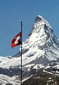 Ric Ergenbright Prints: Europe, Switzerland, Matterhorn. The Swiss flag flies proudly at the base of
