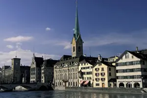 Riverfront Prints: Europe, Switzerland, Zurich. Daytime view of Fraumunster Church and River Limmat