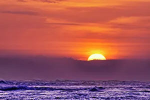 Images Dated 28th December 2022: Each evening the incredible colors of the setting sun becomes a tourist mecca on the beaches of Bali